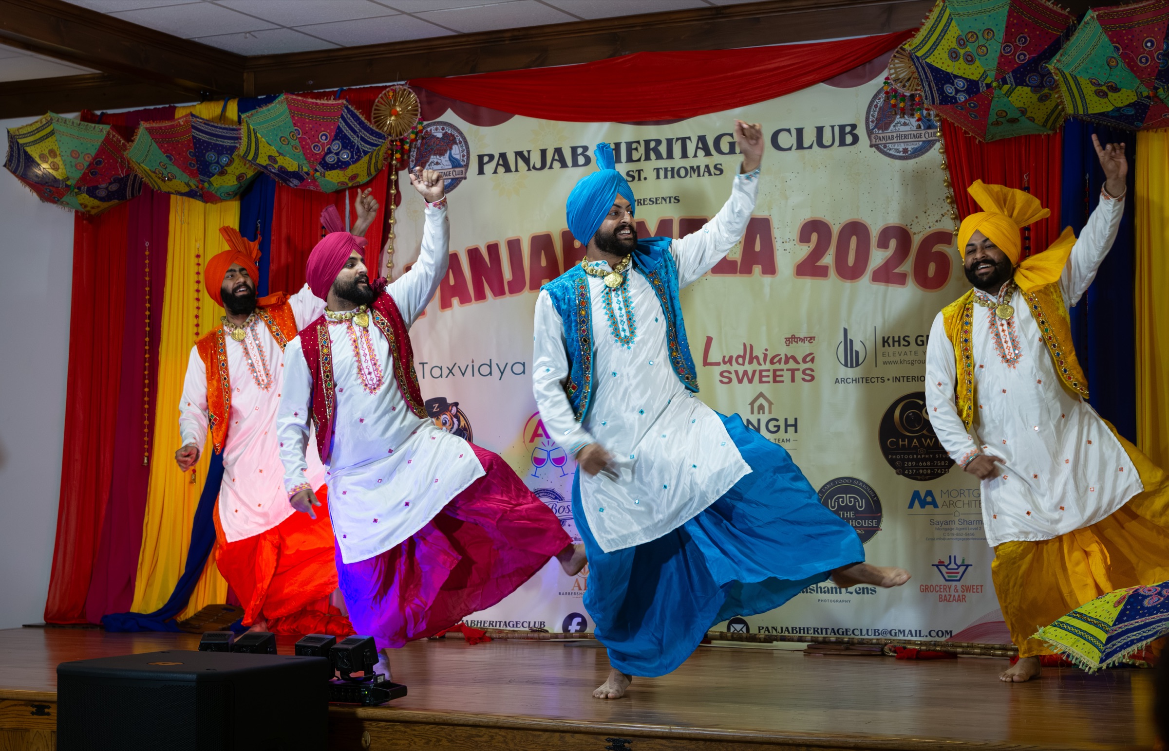 Bhangra dancers performing on stage at Panjabi Mela 2026, Panjab Heritage Club of St. Thomas — event photography in Southwestern Ontario