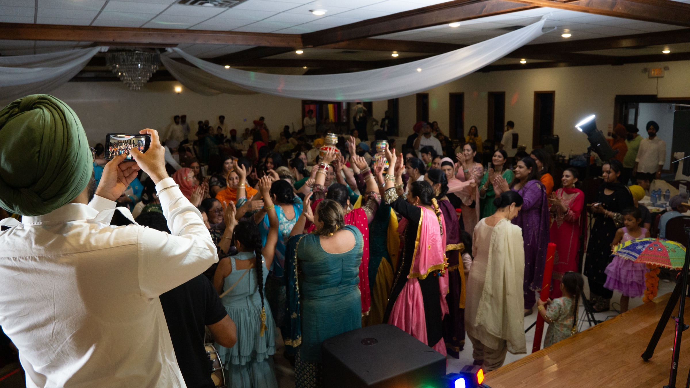 Guests dancing in a circle at Panjabi Mela 2026 in St. Thomas, Ontario — cultural event photography